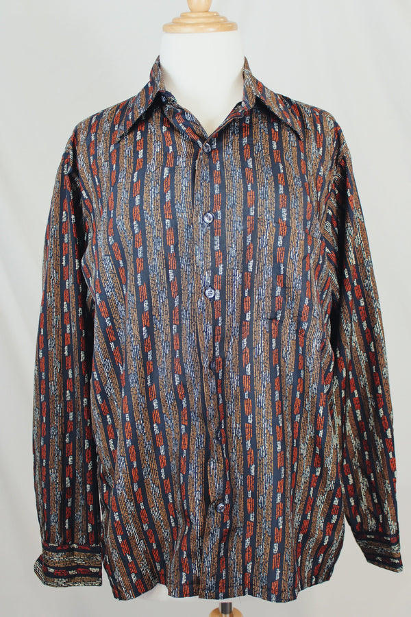 Men's or women's vintage 1970's Montgomery Ward, JCPenney label long sleeve button up shirt in lightweight polyester material. Black with tan and orange vertical stripe pattern.