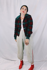Women's vintage 1960's Pendleton label long sleeve plaid print wool cropped lightweight jacket in red and green colors. Fully lined, buttons up the front, and two front pockets.