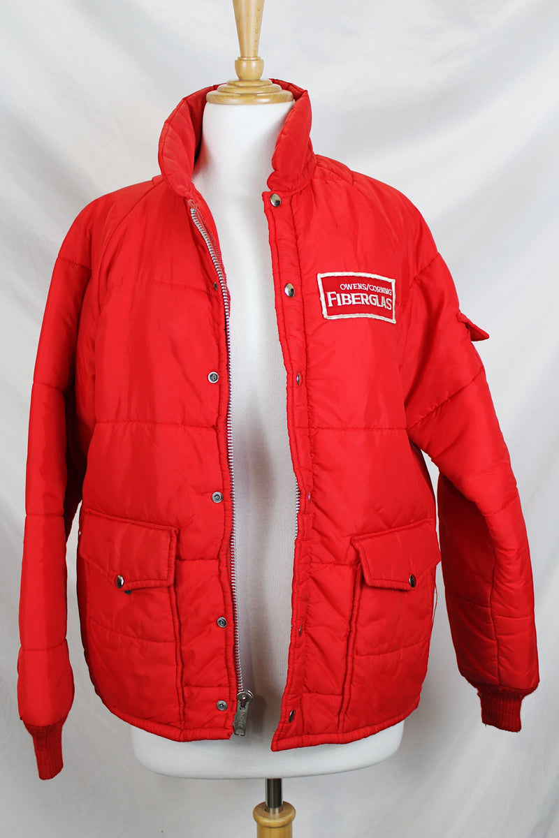Women's or men's vintage 1980's Horizon Sportswear Inc., Made in USA label long sleeve red nylon puffer jacket with patch on left chest.