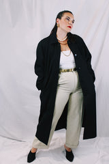 Women's vintage 1990's Nordstrom - Point of View label long sleeve long length black trench coat in a wool material. Fully lined, side pockets, back slit, and shoulder pads. 