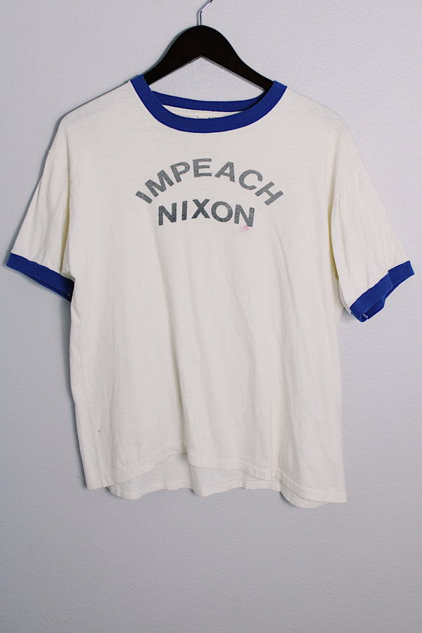 Men's or women's vintage 1970's Quality Sportswear Products, Made in USA label white ringer tee with blue trim and black graphic on the front. 