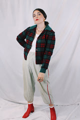Women's vintage 1960's Pendleton label long sleeve plaid print wool cropped lightweight jacket in red and green colors. Fully lined, buttons up the front, and two front pockets.