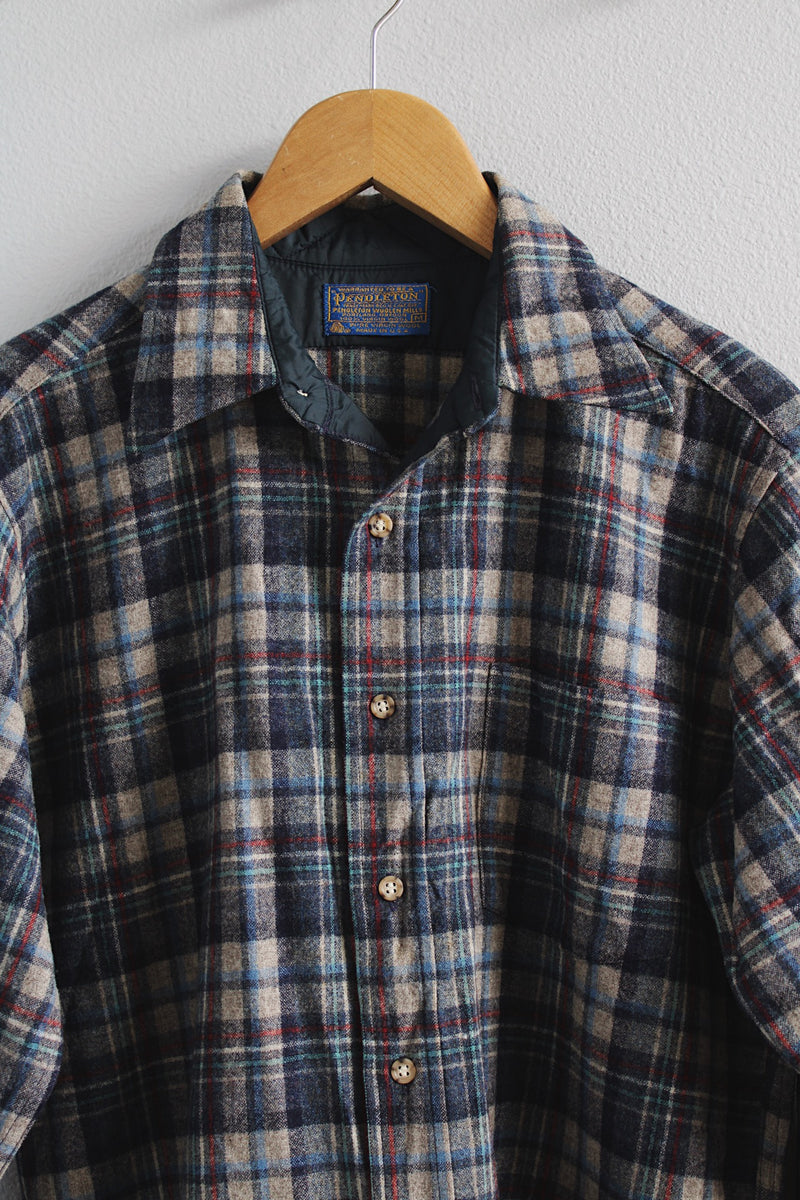 Men's vintage 1980's Pendleton label long sleeve button up wool shirt in size medium. All over grey and blue plaid print