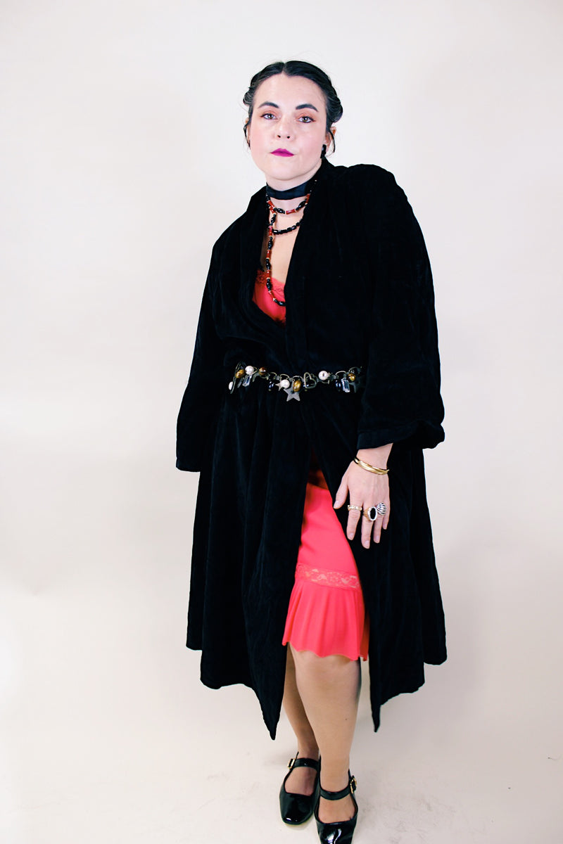 Women's vintage 1960's ankle length long sleeve black velvet duster jacket. Fully lined and has two side pockets. 