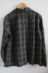Men's vintage 1960's Hand Made by Alba Arnold label size large long sleeve button up shirt in blue and grey plaid in wool material. Has two chest pockets.