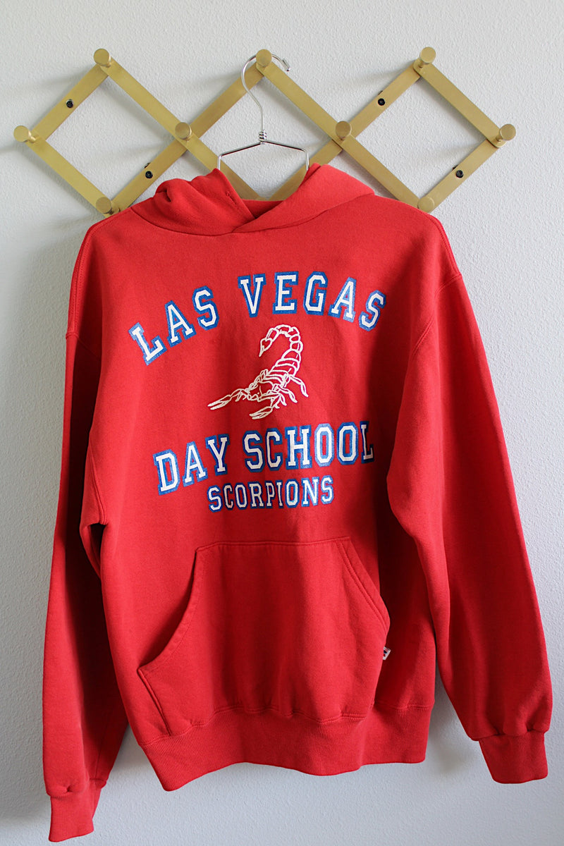 Women's or men's vintage 1980's Russell Athletic, Made in USA label long sleeve red hoodie sweatshirt with red and white graphic on the front of a scorpion from Las Vegas day school. 
