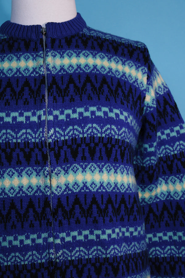 Women's vintage 1970's long sleeve printed zip up sweater in different shades of vibrant blue in a soft wool material. Norwegian style. 