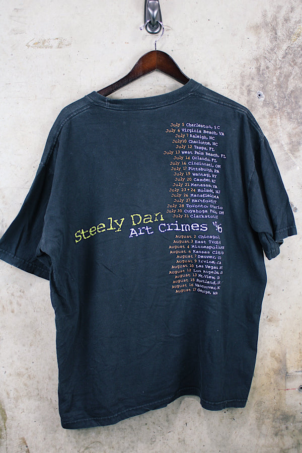 Women's or men's vintage 1996 Made in El Salvador label short sleeve black Steely Dan tour tee with multicolored graphic on front and back.
