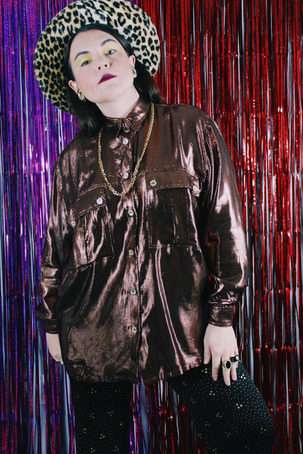 Women's vintage 1980's Made in USA long sleeve button up blouse with two chest pockets and pearly buttons.