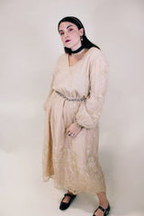 Women's vintage 1960's ankle length cream dress with lace overlay that has gold metallic detail. Beaded belt and beaded cuffs.