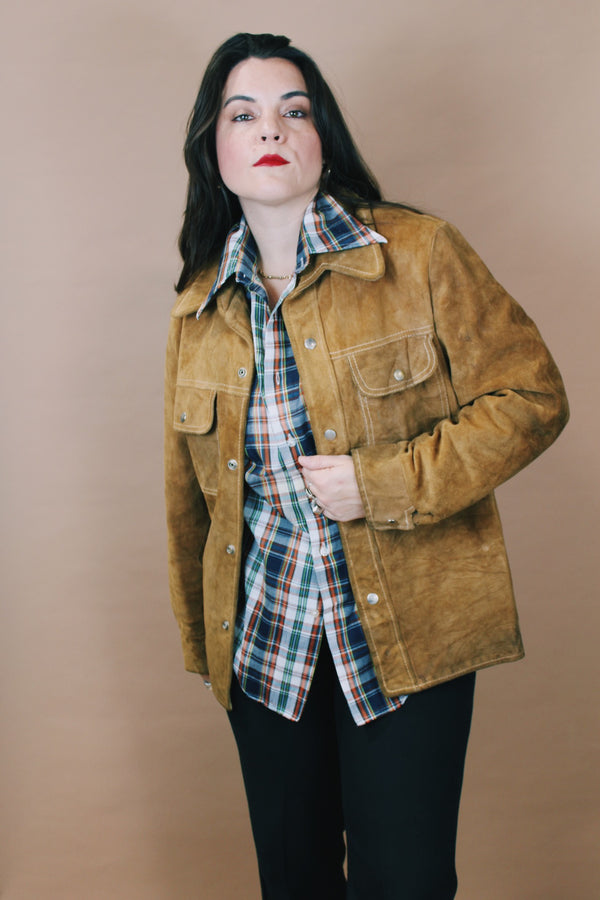 Men's or women's vintage 1970's Genuine Leather label size medium long sleeve light tan brown suede western style jacket with popper buttons. 