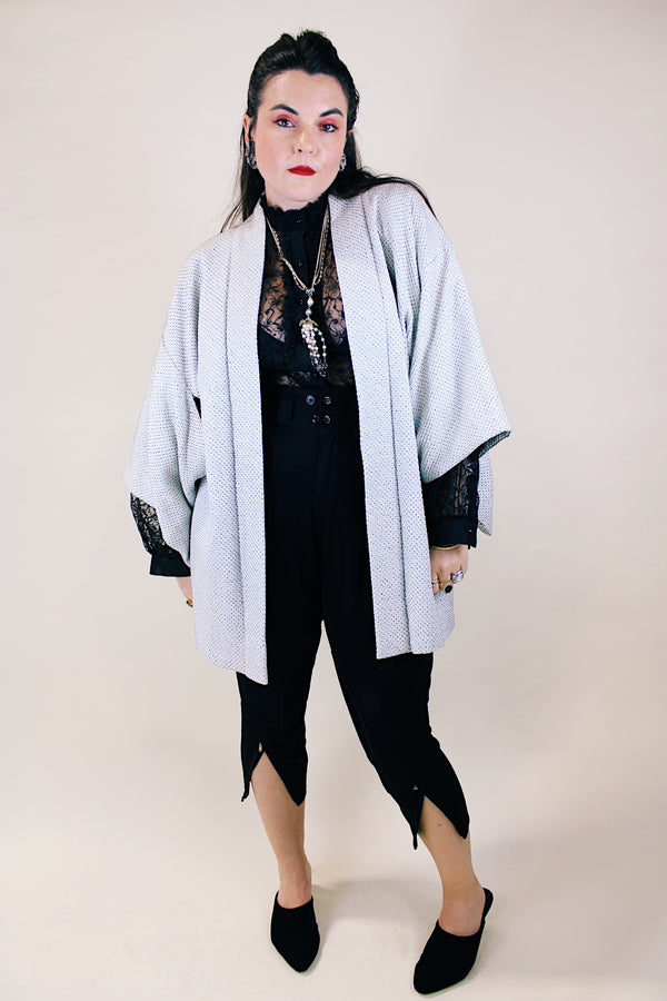 Women's vintage 1960's long sleeve textured kimono. Baby blue color with blue and white floral liner. Ties in the front. Wide big sleeves. 
