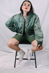 Men's or women's army zip up bomber jacket with long sleeves. Army green color with orange satin liner. Reversible.