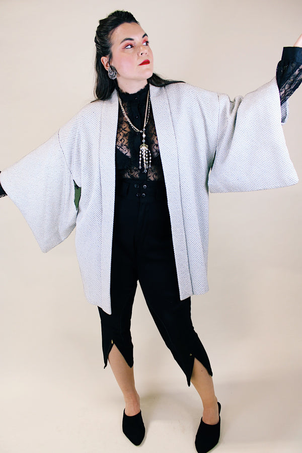 Women's vintage 1960's long sleeve textured kimono. Baby blue color with blue and white floral liner. Ties in the front. Wide big sleeves. 
