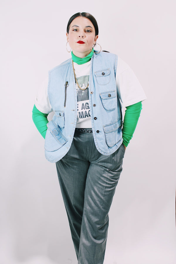 Women's or men's vintage 1990's Casey & Max label light blue denim sleeveless best with all over pockets and bronze hardware. 
