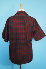 Men's vintage 1960's Pendleton short sleeve button up plaid shirt in a lightweight wool material. Red and grey colors with one chest pocket.