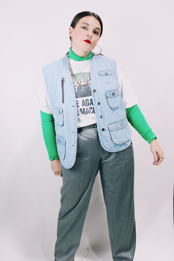 Women's or men's vintage 1990's Casey & Max label light blue denim sleeveless best with all over pockets and bronze hardware. 