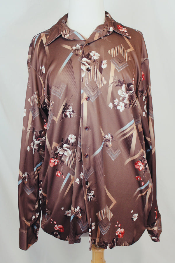 Men's vintage 1970's Montgomery Ward label long sleeve light brown colored button up shirt with all over floral print. 