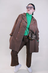 Women's vintage 1970's lightweight brown colored pea coat with a double breasted closure. Brown buttons and white contrast stitching