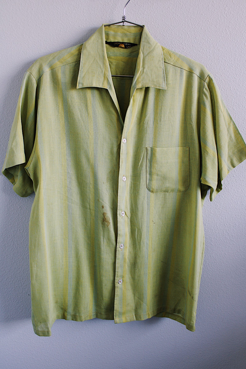 Men's vintage 1960's Sears label short sleeve button up shirt with collar and one left chest pocket in a lime green striped cotton material. 