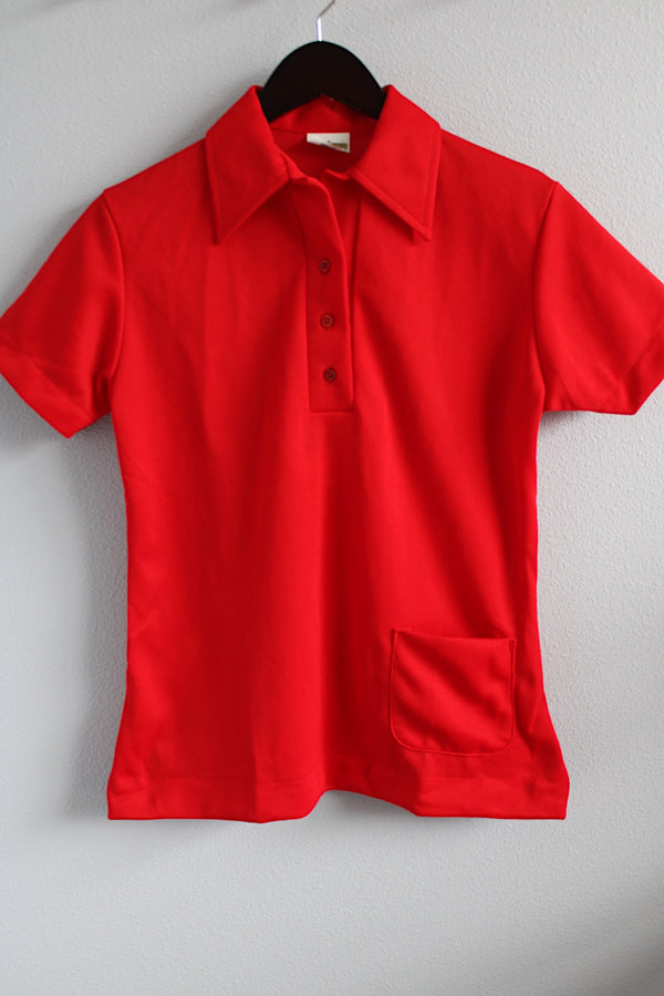 Women's vintage 1970's King Louie Creation, Made in USA label short sleeve red bowling top with half button closure, collar, and a pocket in polyester.