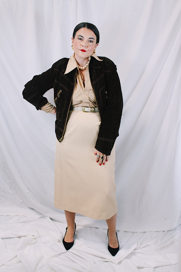 Men's or women's vintage 1970's long sleeve short length chocolate brown jacket in a fuzzy soft suede material. Gold hardware, zipper up the front, contrast stitching, and dagger collar.