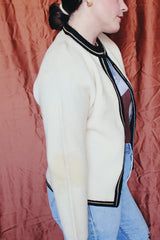 Women's vintage 1960's Brentwood Sportswear label long sleeve zip up cardigan in a waffle knit cream color. Has black and tan trim throughout.