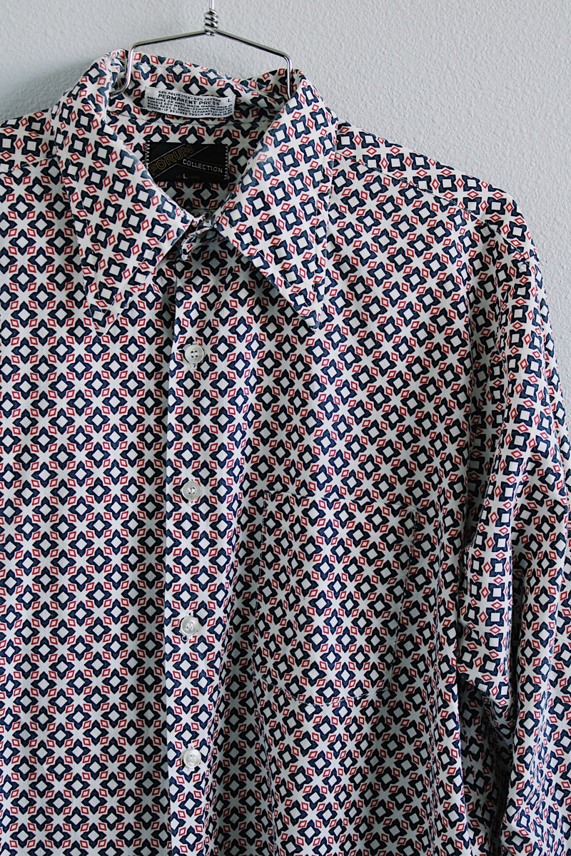 Women's or men's vintage 1970's Forum Collection label long sleeve button up shirt in white with all over navy and red abstract print. 