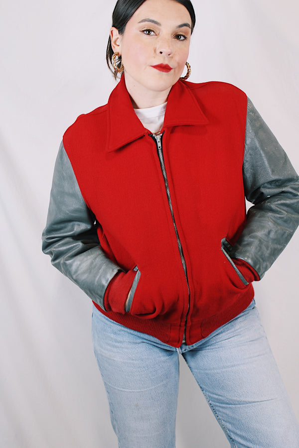 Men's or women's vintage 1960's Dick Longtin's Sports Huddle label long sleeve leather and wool zip up varsity letterman jacket in grey and red with pockets and nylon liner.