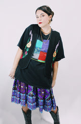 Women's vintage 1970's sleeveless black cotton vest with floral embroidery on the front and multicolors on the back