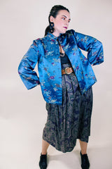 Women's vintage 1960's long sleeve vibrant blue satin robe jacket with a mandarin collar and overall ditsy print.