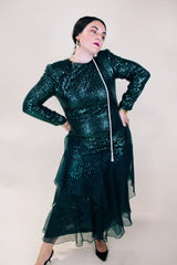 Women's vintage 1980's long sleeve ankle length dress with all over sequins and a tiered ruffles skirt. Forest green color. 