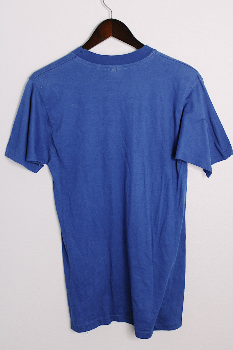 Women's or men's vintage 1970's E, IMEX, Made in Mexico label short sleeve blue tee with white slogan on the front in a cotton or polyester material.
