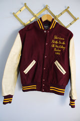 Women's or men's vintage 1982 Nelson's Jackets, Portland, Oregon label long sleeve letterman jacket with a maroon wool body and cream colored leather arms. Yellow stripped trim and popper buttons. Embroidery on chest.