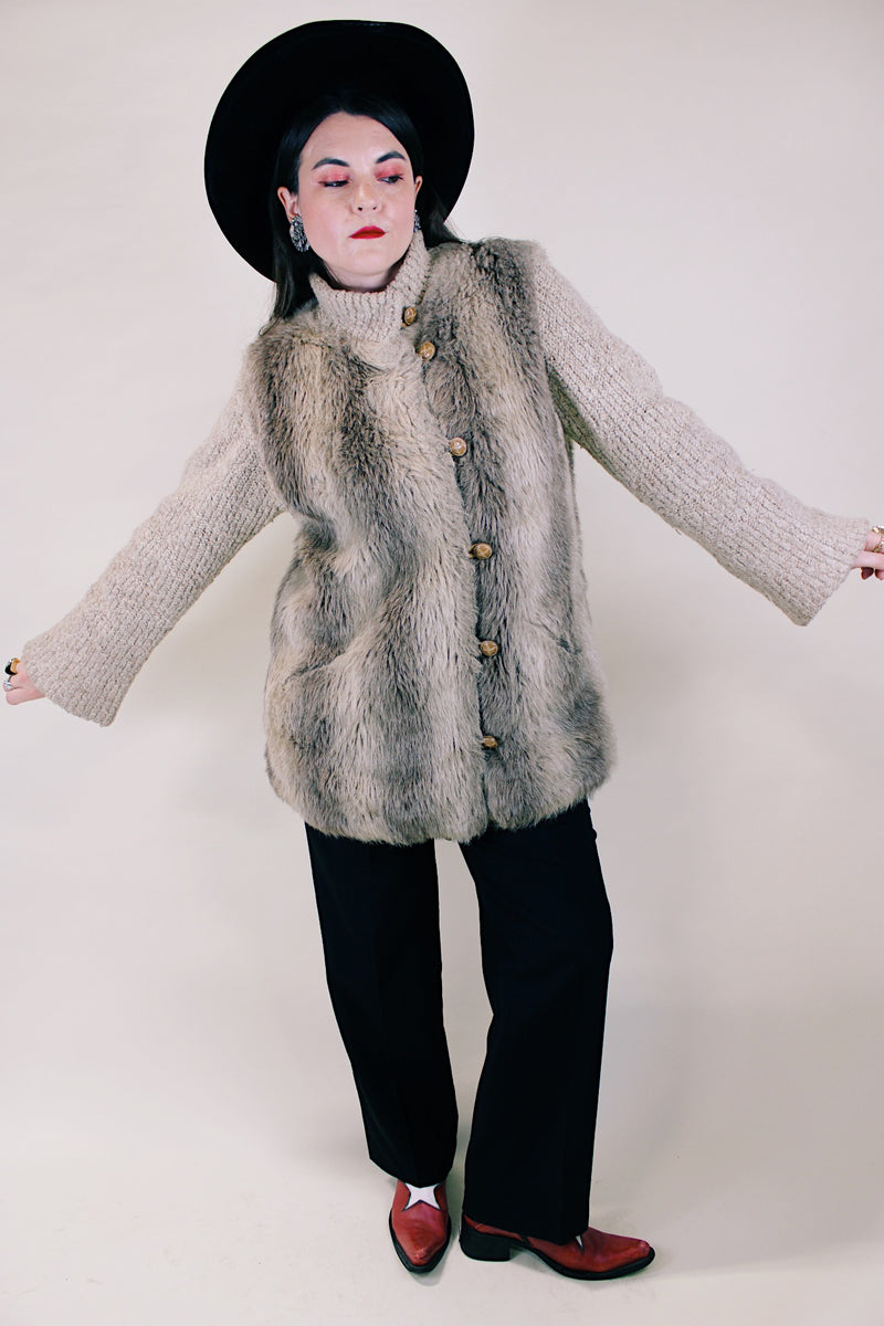 Women's vintage 1980's Lifestyle 80's by Andrea Ungar label long sleeve jacket with faux fur body in front and back and acrylic arms. Buttons up the front with side pockets. 