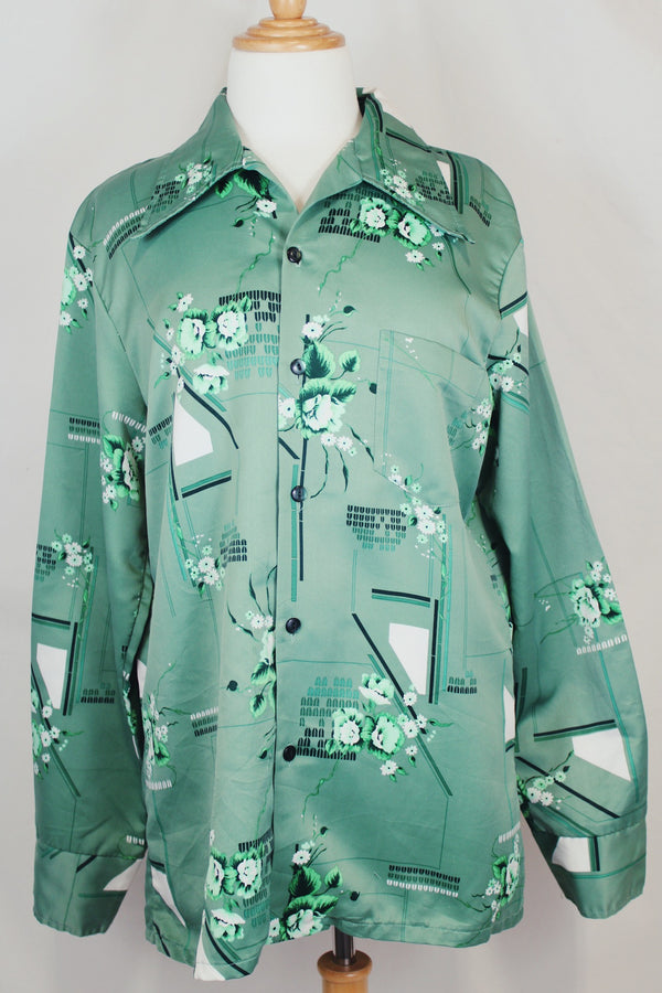 Men's vintage 1970's Don Giovanni California label long sleeve green colored button up shirt with all over floral print in a thick polyester material. 