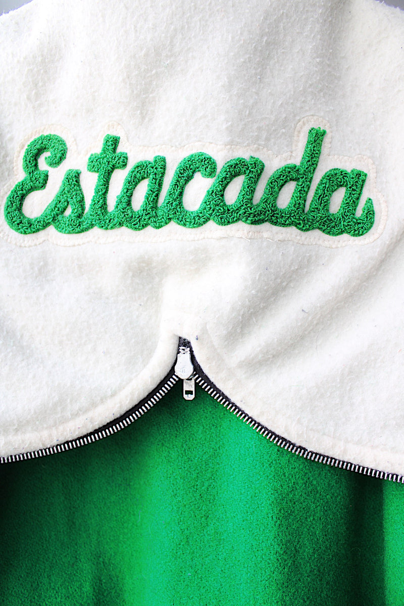 Women's vintage 1989 Nelson's Jacket, Portland, Oregon label bright green wool varsity letterman jacket with white trim. Has snap buttons, patches, pockets, and a hood. Shop more vintage outerwear and sportswear at Live Forever Vintage. 