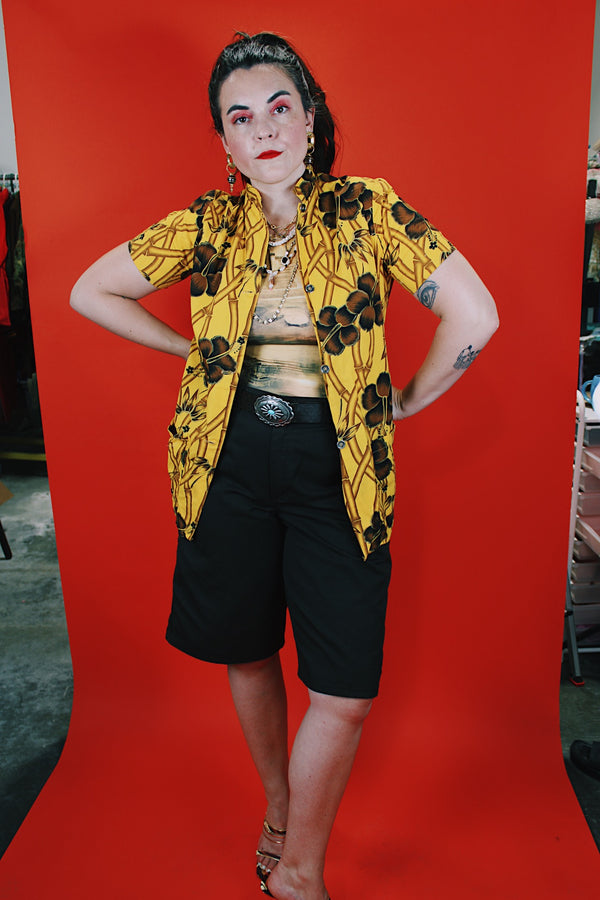 Women's vintage 1970's La Rosa, San Francisco label short sleeve button up blouse in yellow with all over brown Hawaiian print.