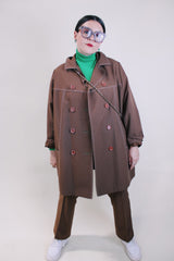 Women's vintage 1970's lightweight brown colored pea coat with a double breasted closure. Brown buttons and white contrast stitching