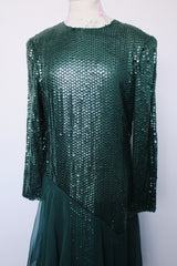 Women's vintage 1980's long sleeve ankle length dress with all over sequins and a tiered ruffles skirt. Forest green color.