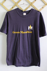Women's or men's vintage 1970's Hi Cru by Stedman label short sleeve navy blue t-shirt with yellow and white graphic and text on front and back from Guam Marathon.