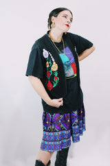 Women's vintage 1970's sleeveless black cotton vest with floral embroidery on the front and multicolors on the back