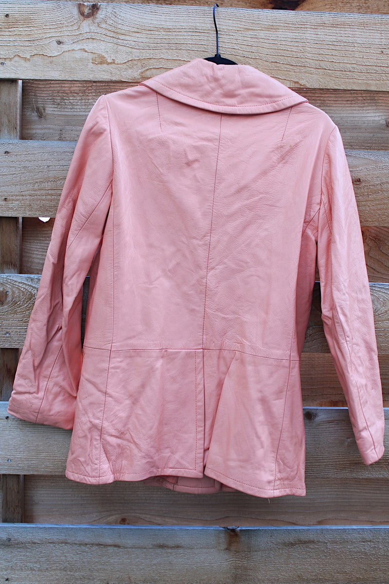 Women's vintage 1970's peach pink colored leather double breasted pea coat. Double lapel, pockets, and fully lined. 