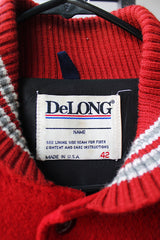 Men's or women's vintage  1980's DeLong, Made in USA label long sleeve dark red and grey varsity letterman jacket with patches and pins. Wool and leather material.
