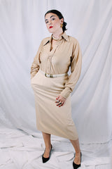 Women's vintage 1980's large sized tan beige colored pencil skirt with a midi length. Has two side pockets and zipper closure. Wool material and fully lined. 