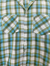 Men's or women's vintage 1970's JCPenney label long sleeve button up shirt in a white, green, and blue plaid print. Clear buttons, two chest pockets.