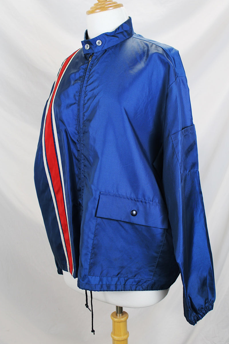 Men's or women's vintage 1980's Swingster Wearables, Made in USA label long sleeve zip up windbreaker in navy color and nylon material. 
