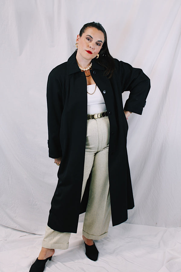 Women's vintage 1990's Nordstrom - Point of View label long sleeve long length black trench coat in a wool material. Fully lined, side pockets, back slit, and shoulder pads. 