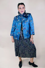 Women's vintage 1960's long sleeve vibrant blue satin robe jacket with a mandarin collar and overall ditsy print.
