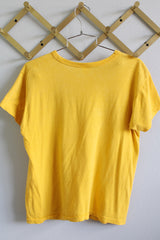 Women's vintage 1979 Russell Athletic label short sleeve yellow tee with black graphic on the front from The Rubinoos Tour 1979.